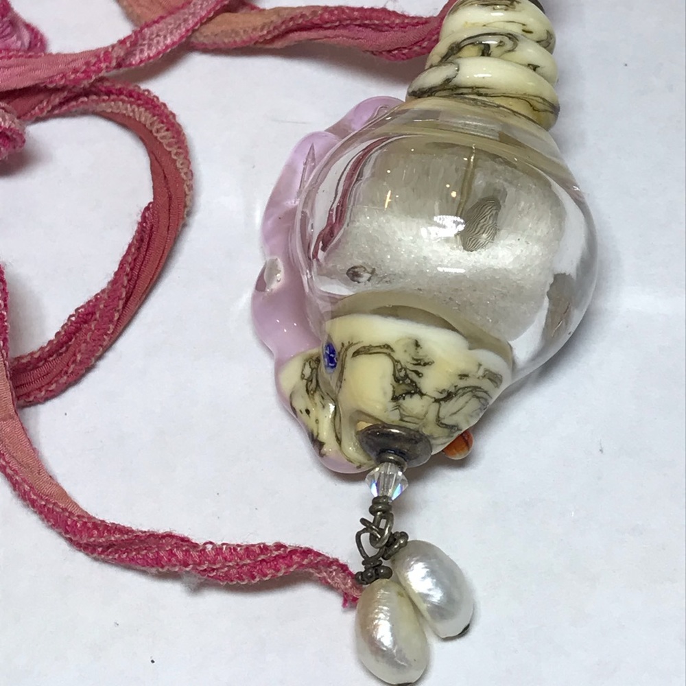 Glass shell sand pendant artisan